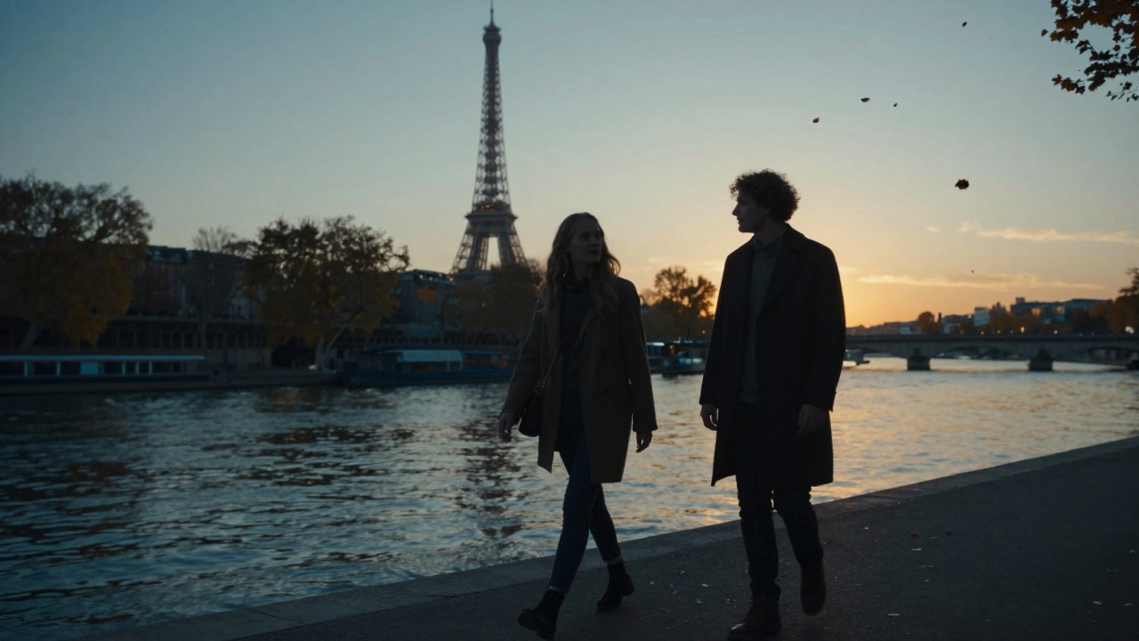 A man and woman walking peacefully along the Seine at sunset, reflections on the water.
